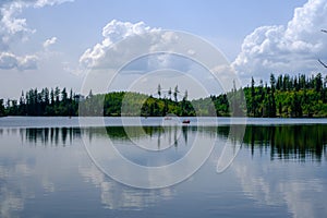 Strbske pleso. High tatras mountains. Vysoke tatry. Autumn forest. Reflection in lake. Beautiful landscape. Slovakia.