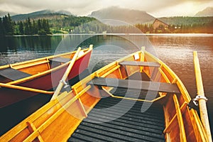 Strbske Pleso lake with boats in High Tatras.