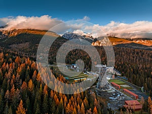 Strbske Pleso, Slovakia - Aerial view of the Strbske Lake area with autumn foliage, sightseeing tower and the High Tatras