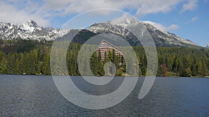 Strbske pleso and Tatra peaks visible from the back. A village l