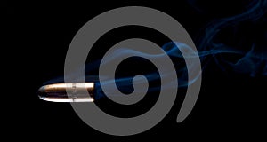 Streaking bullet on black