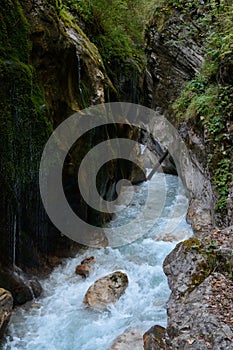 Stream in deep rocky ravine.