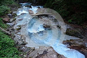 Stream in deep rocky ravine.