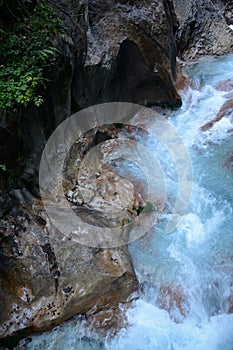 Stream in deep rocky ravine.