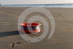 Stream of fishing line on a sandy beach.  Evening sea fishing.  Fisherman's Tools