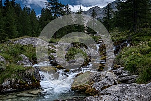 Stream flowing down the mountain in the Swiss Alps