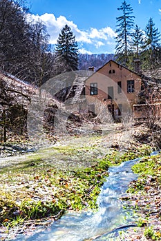 Stream flowing next to a house