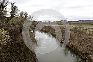 the stream flows next to the agricultural land.