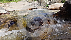 Stream of fresh water coming down from the high mountain, slow motion.