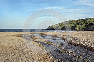 Stream leading down to Freshwater East beach in evening