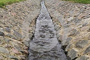 The stream leaving afar.