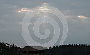 Stream of light cut through clouds and beam blockhouse