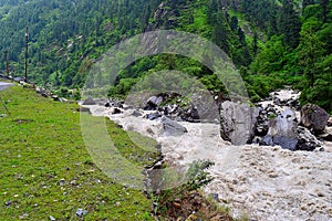 Stream meeting river Bhagirathi among Himalayan Mountains, Uttarakhand, India