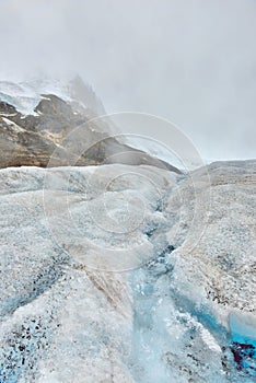 Stream of melted snow on the glacier along the Icefields Parkway between Banff and Jasper in the Canadian Rockies