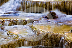 Stream motion deep forest waterfall close up