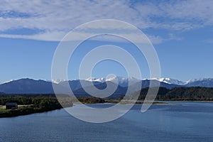 Stream in New Zealand West Coast, Hokitika River with Southern Alps