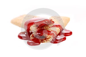 Stream red syrop on stics of biscuit.