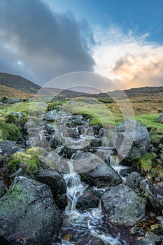 Stream with small waterfalls and cascades in Glendalough, Wicklow Mountains, Ireland