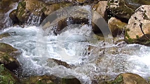 Stream water flowing endlessly among the stones.
