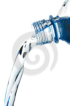 Stream of water flows from the bottle