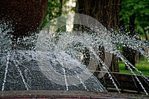 Stream of water from the granit fountain.