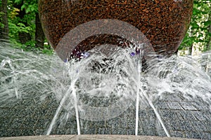 Stream of water from the granit fountain.