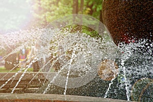 Stream of water from the granit fountain.