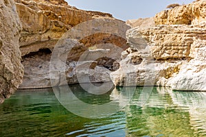 A stream of water in the rocky desert of Oman flowing in a canyon to the oasis of Wadi Bani Khalid - 6