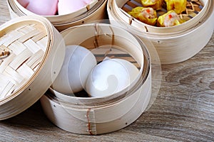 Streamed chinese buns, Dim Sum in round bamboo crate