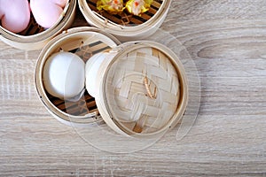 Streamed chinese buns, Dim Sum in round bamboo crate