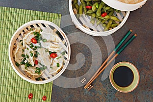 Streamed Gyoza Jiaozi and Edamame beans photo