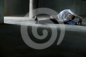 Streching man on parking lot