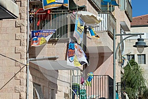 Street ads for the mayoral election, on the balcony of a house in the Geula neighborhood