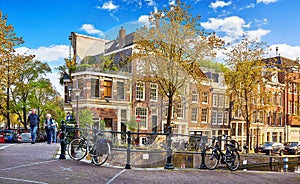 Street of Amsterdam city. Bridge over channel