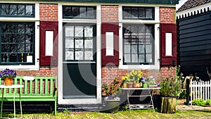 A street in Amsterdam in early spring. A cozy cafe in Dutch style. Exterior of a rustic cafe. House Easter decoration with spring