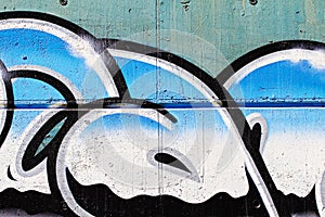 Street art, segment of an urban grafitti on wall, chrome letters