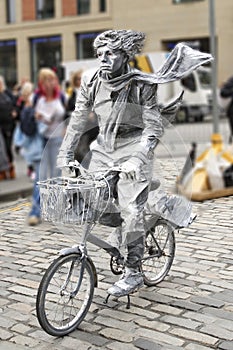 Street artist with a bike