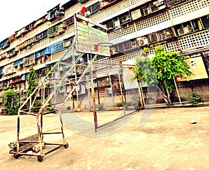 Street basketball court in front of apartments bloc in Bangkok, Thailand. photo