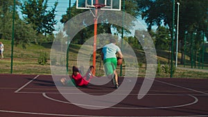 Street basketball player committing offensive foul