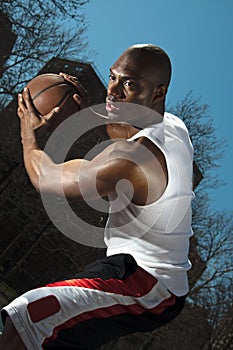 Street basketball player guarding ball