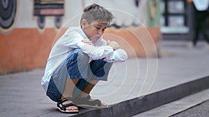 Street Battle: Young Boy Fighting Sleepiness Outdoors