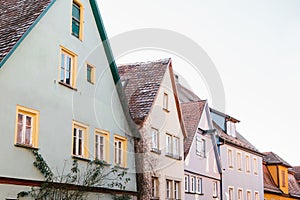 Street with beautiful colorful houses in a row in Rothenburg ob der Tauber in Germany. European city.