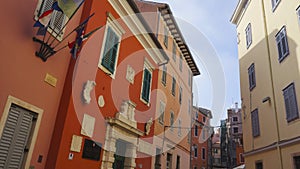 Street with beautiful old colorful buildings in small Adriatic coast city Rovinj, Croatia