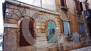 Street with beautiful old colorful buildings in small Adriatic coast city Rovinj, Croatia