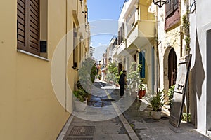 The street is being scrubbed and the windows cleaned at Metaxaki street in the old town of Rethymno, Crete, Greece
