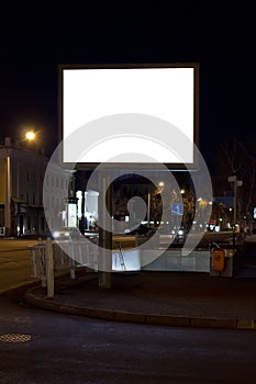 Street billboard on the city street at night