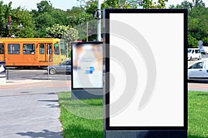 street billboard mock-up ad sign. lightbox at tram stop. urban background. blank white place holder