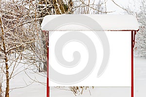 Street billboard with white blank background in winter park for business commercial advertising, text, images.