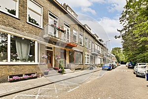 a street with brick buildings and cars parked on it