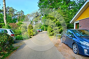 Street at a Bungalowpark parked with cars at recreation park estate Netherlands, opening afther corona lockdown